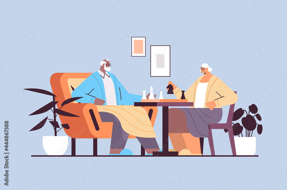 Fototapeta premium elderly couple playing chess senior man woman spending time together horizontal