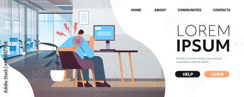 businessman at workplace suffering from shoulder pain inflammation of muscles concept