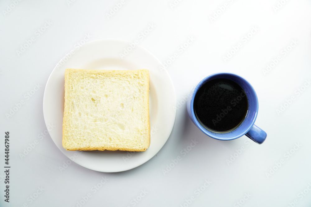 Top View of Breakfast Concept White Bread on plate with a cup of coffee on white background