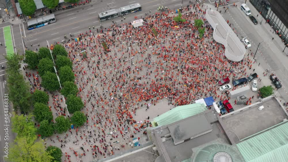Cinematic Top Down Aerial of a Huge Crowd of protesters occupying a downtown city. The Cancel Canada Day protest at the the Vancouver Art Gallery during the Residential Schools mass graves news