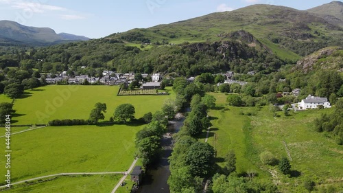 River Glaslyn Beddgelert village in Snowdonia Wales UK Aerial footage summer 4K. photo
