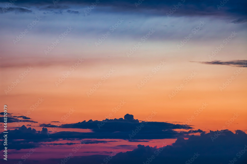 Sunset sky with cumulus clouds background