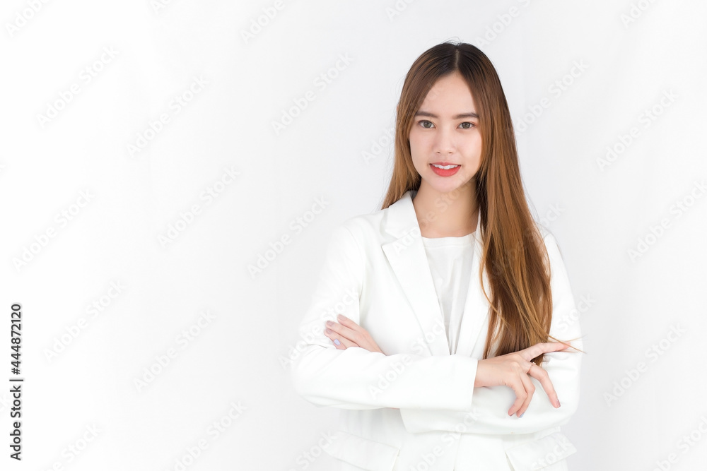Asian beautiful woman who has blond long hair wears white suit and arm crossing while stands with white background. Asian beautiful woman who has blond long hair wears white suit and arm crossing while stands with white background.