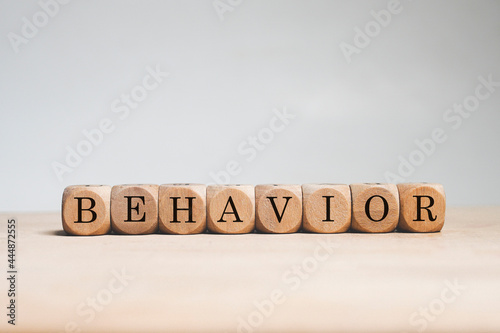Behavior word cube on white background photo
