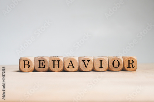 Behavior word cube on white background