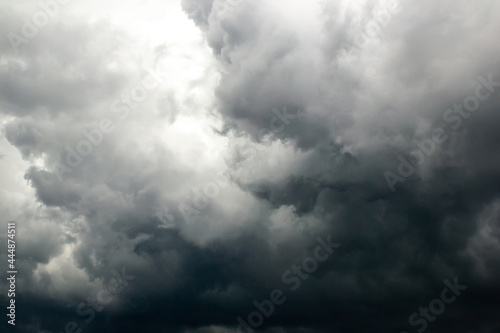 Dark storm clouds before rain. The concept of a threat, an ominous warning. Use as texture, background
