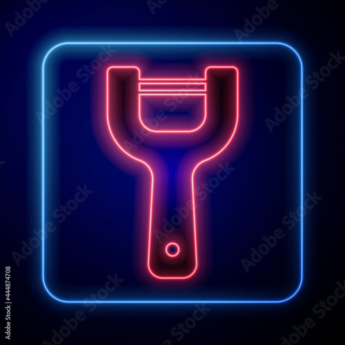 Glowing neon Vegetable peeler icon isolated on black background. Knife for cleaning of vegetables. Kitchen item, appliance. Vector