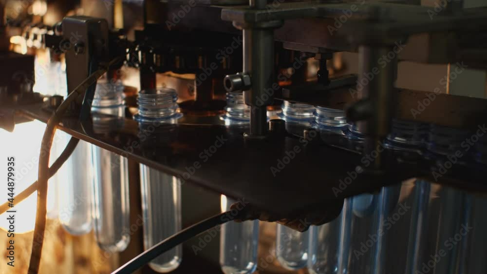 Close-up of a mold in a bottle blowing machine. Plant for the production of drinking and mineral water Close-up of a mold in a bottle blowing machine. Plant for the production of drinking and mineral water