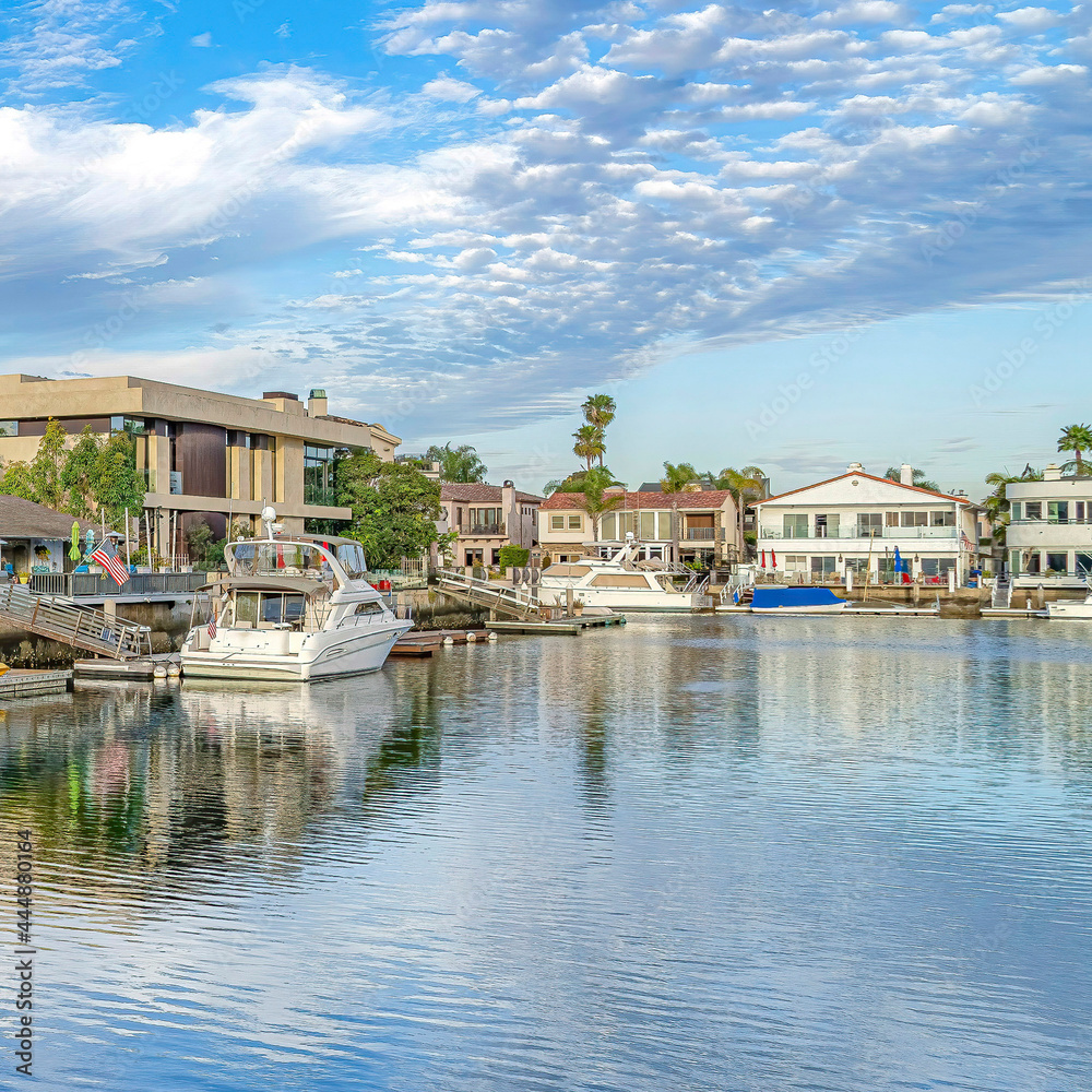 Square Serene seaside scenery at a neighborhood in Huntington Beach on a cloudy day Square Serene seaside scenery at a neighborhood in Huntington Beach on a cloudy day