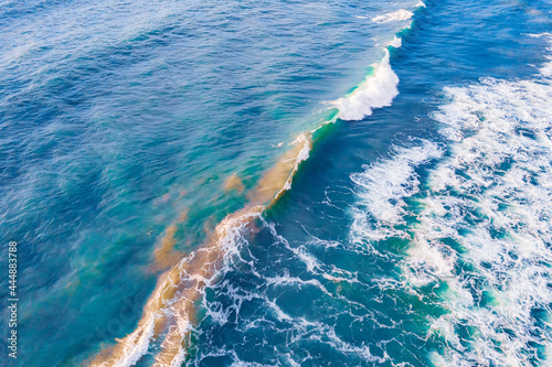 Aerial top view sea amazing nature background. Turquoise and clear water of ocean at sunny day © Parilov