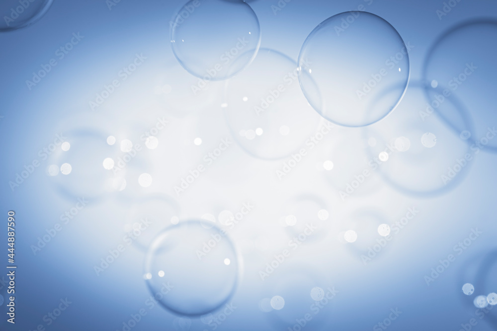 Blurred Transparent Blue Soap Bubbles Floating with Center Copy Space.