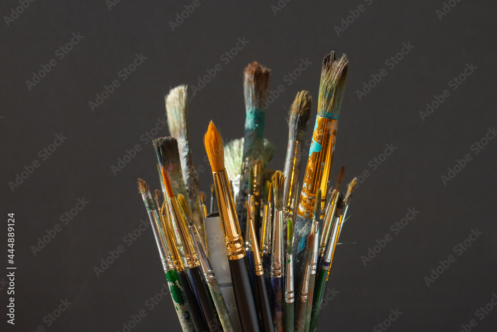 Dirty Paint brushes closeup on gray background Dirty Paint brushes closeup on gray background