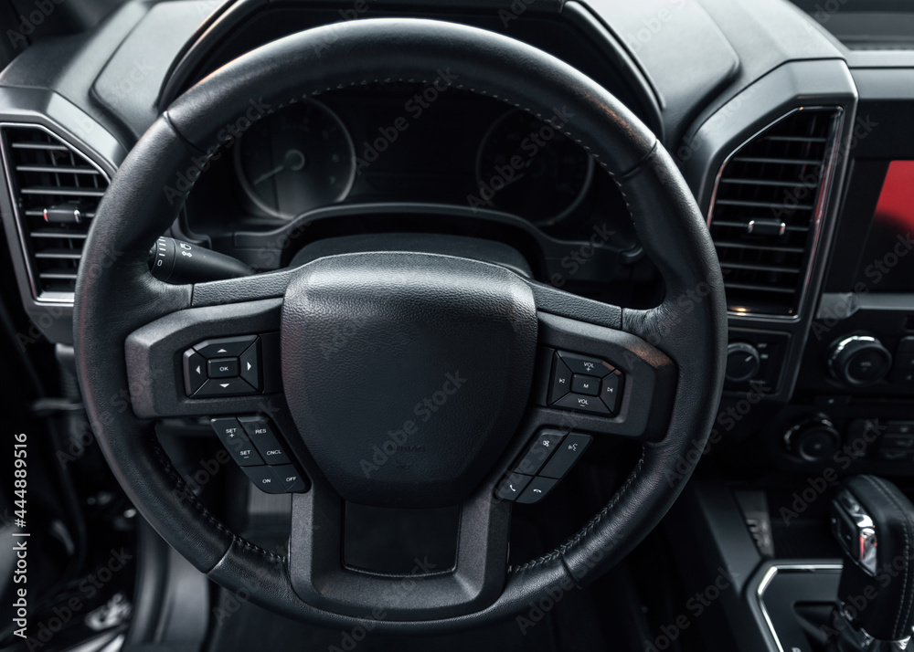 Car steering wheel. vehicle interior. Interior view of car with black salon