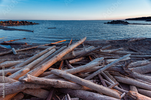 Runners abandoned by logs and anchorages for ships. A picturesque abandoned beach. © Екатерина Акулова