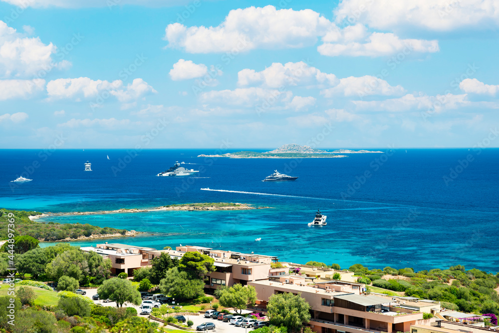 View from above, stunning view of the Marina of Portisco with beautiful beaches bathed by a turquoise water during a sunny day. Sardinia, Italy