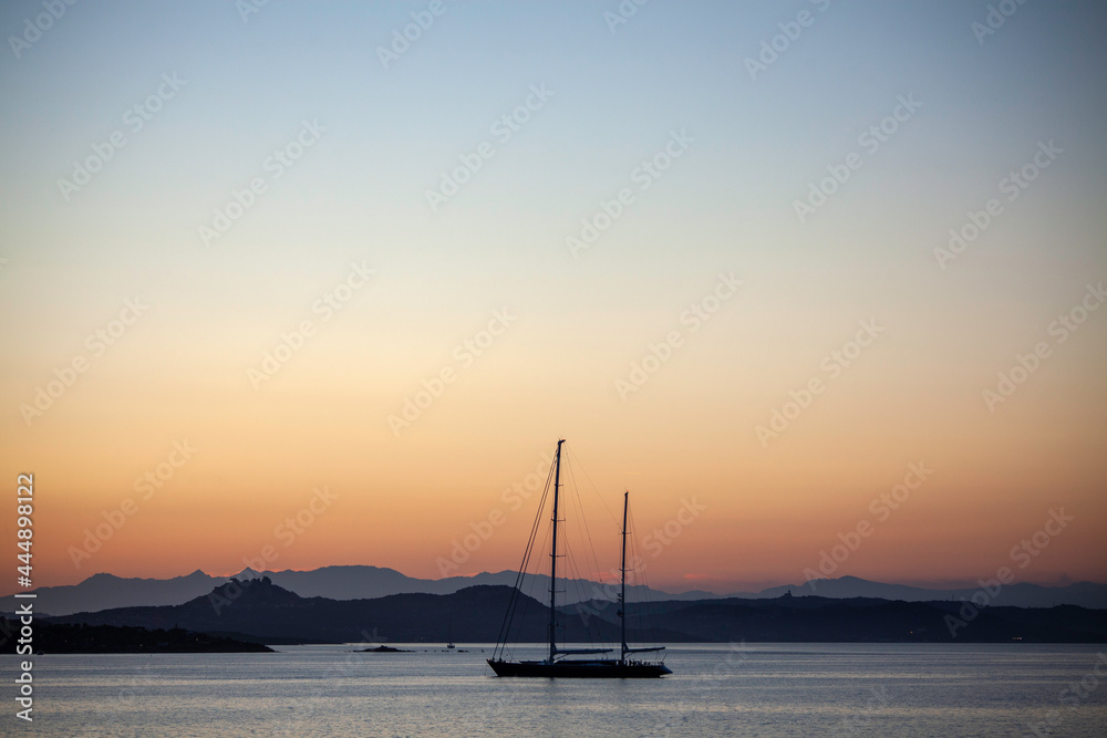 Sailing boat at sunset in Costa Smeralda, Sardinia