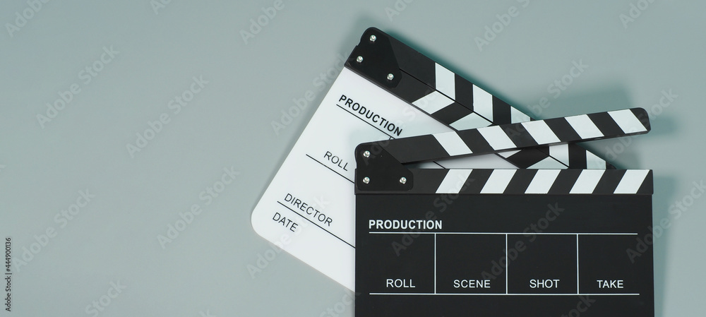 Black and white Clapperboard or clapper board or movie slate use in video production ,film, cinema industry on gray background.