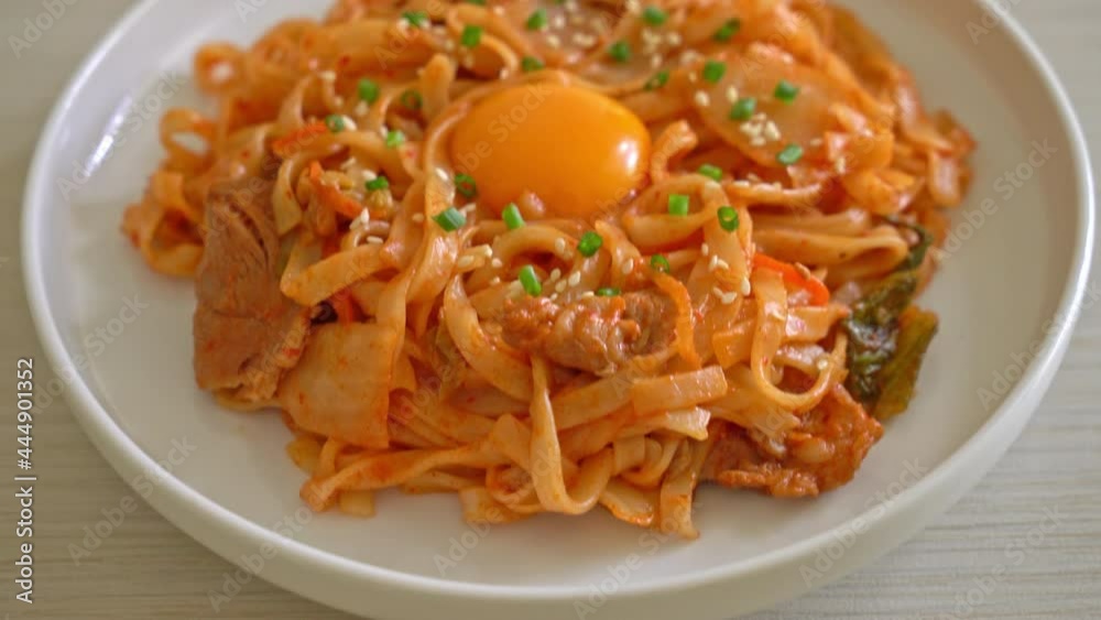 stir-fried udon noodles with kimchi and pork - Korean food style stir-fried udon noodles with kimchi and pork - Korean food style