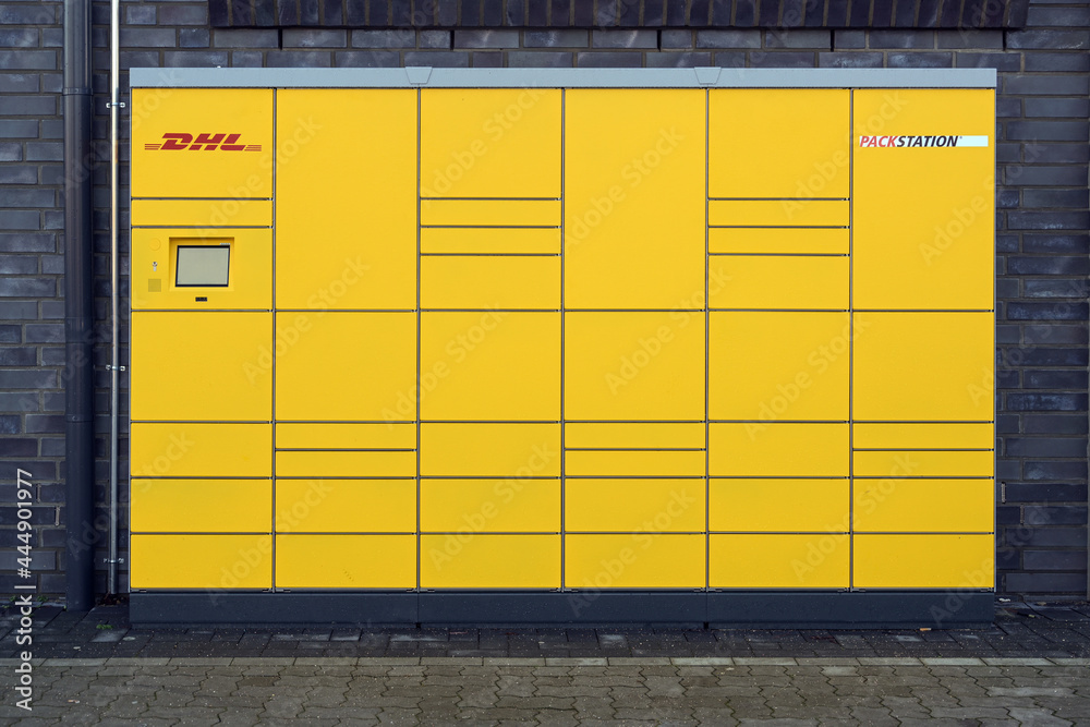 Ratzeburg, Germany, January 12, 2021: Front view of a DHL Packstation  (packing station) with boxes where customers can send and pick up their  packages themselves. Stock Photo | Adobe Stock