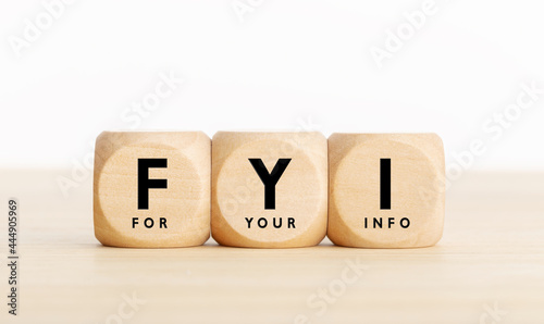 FYI or for your information text on wooden blocks. Copy space