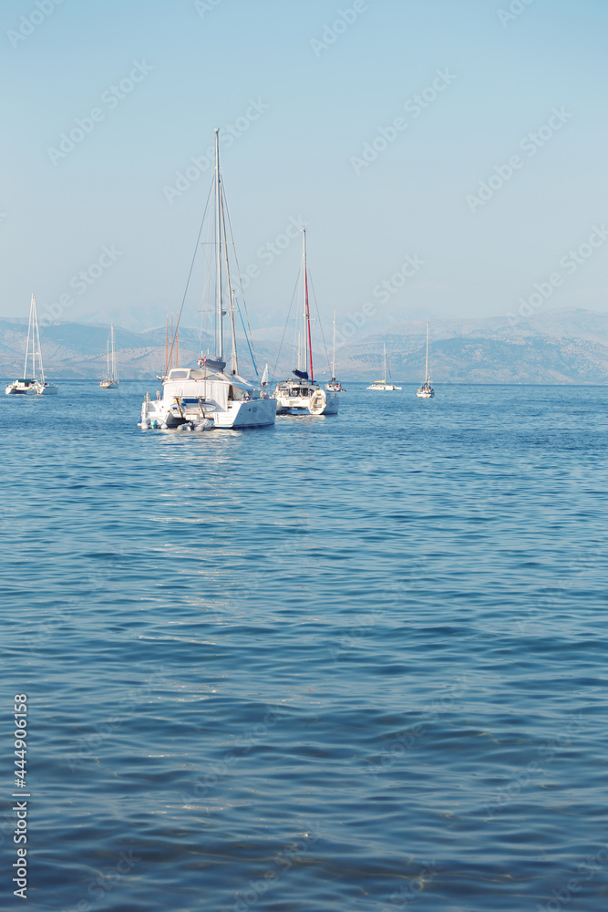 yachts in the bay and mountains in the background