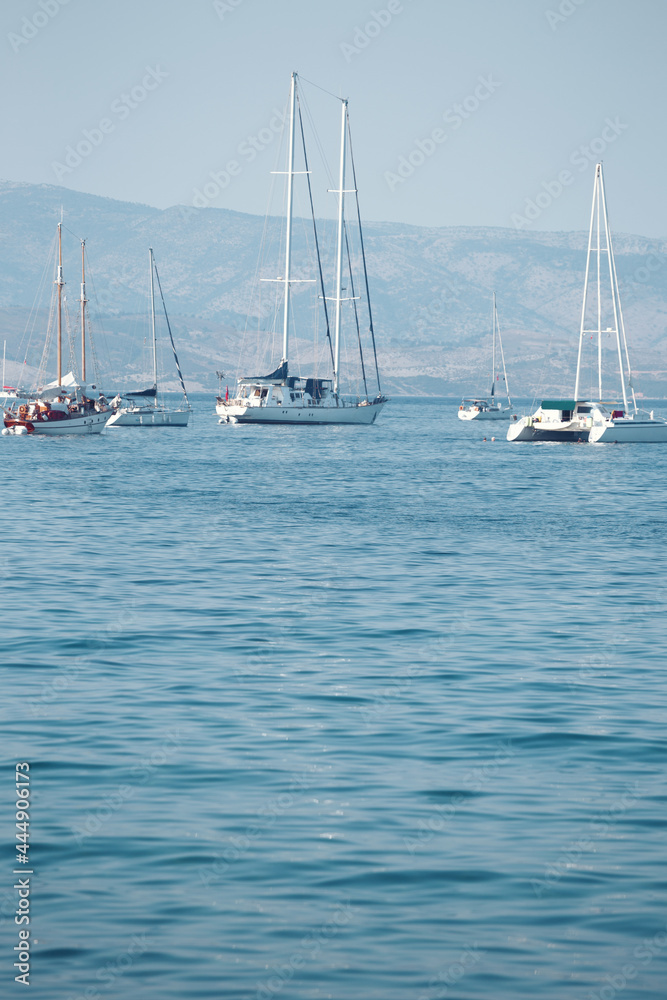 yachts in the bay and mountains in the background