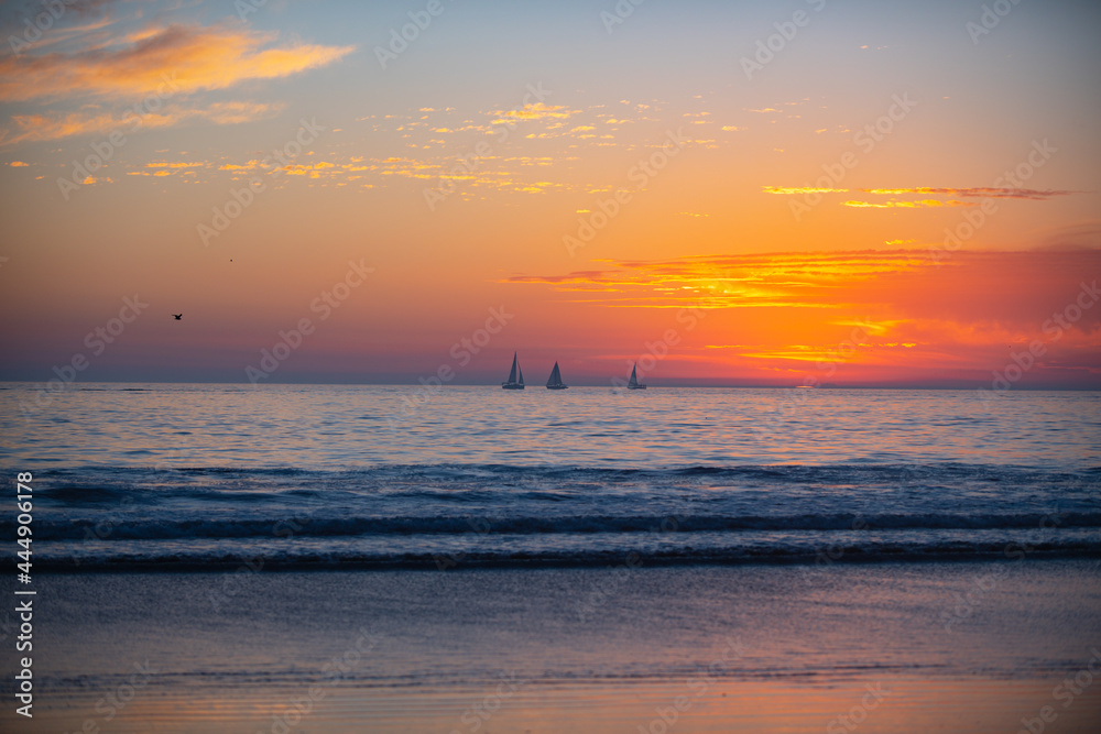 Tropical beach sea ocean with sunset or sunrise for summer travel vacation. Ocean seascape.