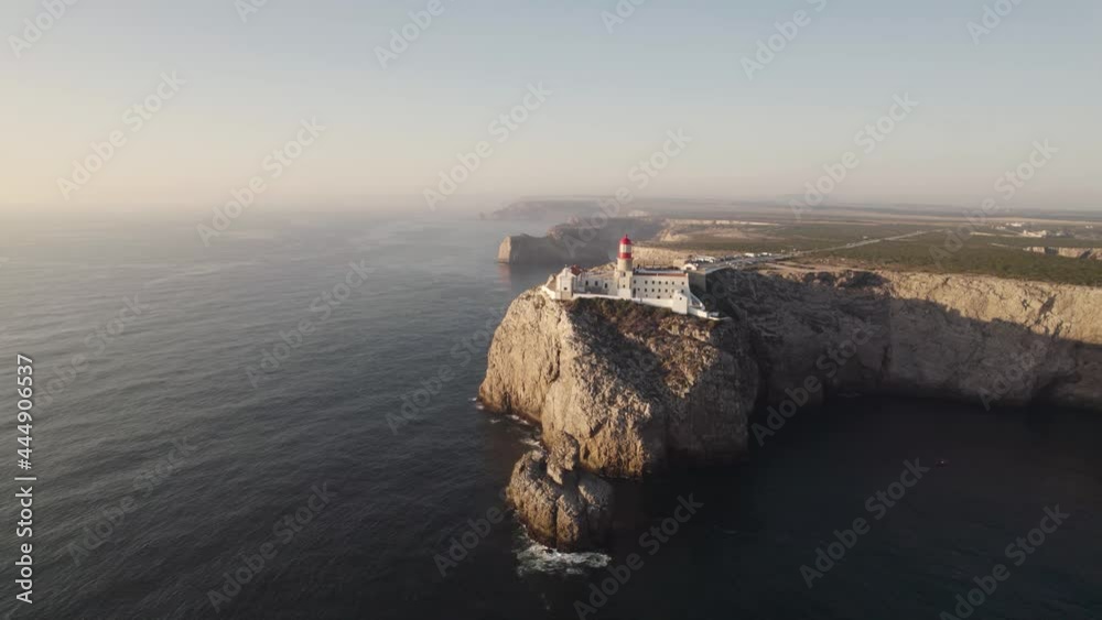  Aerial seascape of touristic Cabo de San Vicente cape saint Vincent lighthouse in Sagres Portugal. 
