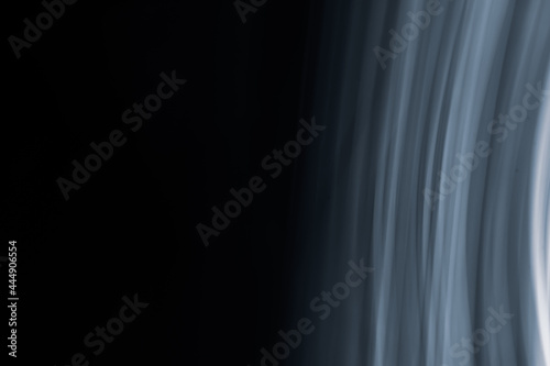 Abstract black background with vertical white-blue semicircles.