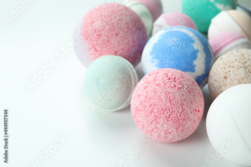 Different bath balls on white background, close up