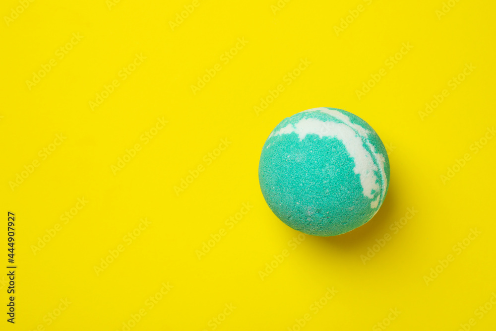 Bath ball on yellow background, space for text Bath ball on yellow background, space for text