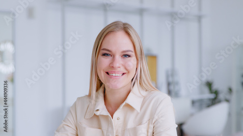 Happy attractive young adult woman model looking at camera