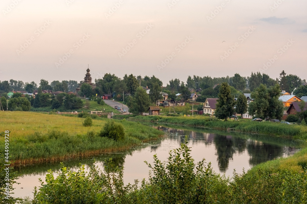 Landscape with a river in the evening. Panorama of the city of Suzdal