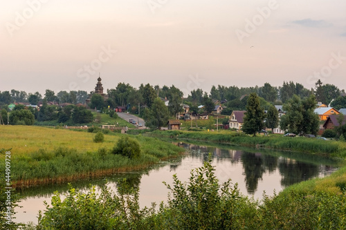 Landscape with a river in the evening. Panorama of the city of Suzdal