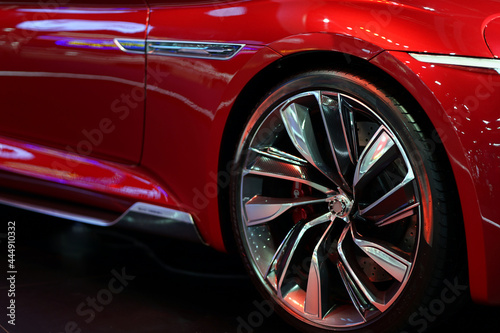 Modern style wheels in a red sports car.