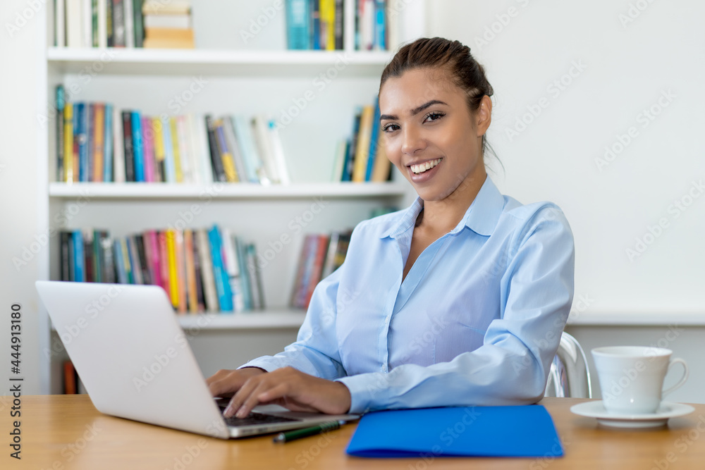 Latin american businesswoman working at computer Latin american businesswoman working at computer