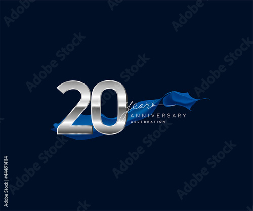 20th Years Anniversary celebration logotype silver colored with blue ribbon and isolated on dark blue background