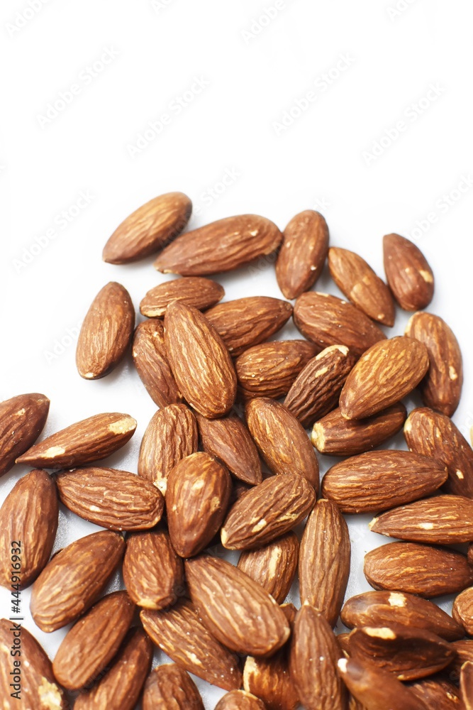 Almonds on white background. Close up. Blurry. Copy space Almonds on white background. Close up. Blurry. Copy space