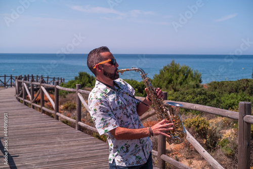 Musician playing saxophone outdoors