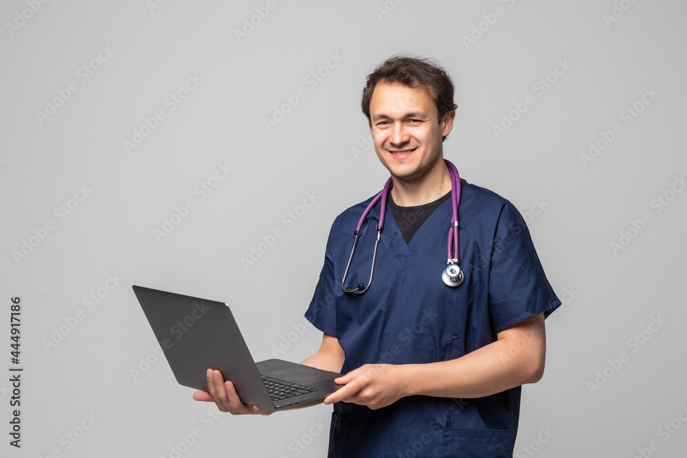 Happy Mature Doctor Using Laptop Over White Background Happy Mature Doctor Using Laptop Over White Background