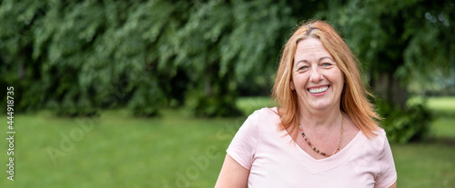 Obraz na płótnie Smiling and happy mature woman portrait at park w salonie