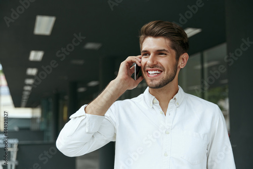 Pleased european business man talk on mobile phone © Drobot Dean