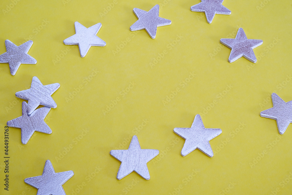 Traditional christmas yellow background with silver stars for greeting lettering or announcement
