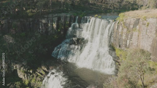 an autumn afternoon tilt down view of upper ebor falls at ebor in nsw, australia photo