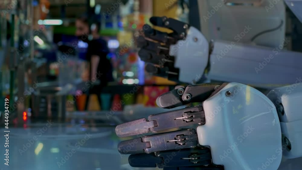 Robots serve visitors. The video shows two mechanical arms. Hand segments allow for movement. The arms end with a gripping mechanism. The life of robots in the future. Robots serve visitors. The video shows two mechanical arms. Hand segments allow for movement. The arms end with a gripping mechanism. The life of robots in the future.