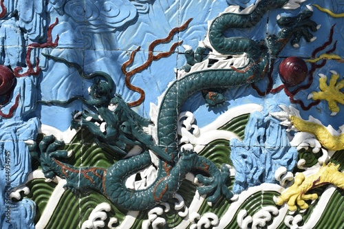 dragon, bas-relief on the wall © tanzelya888