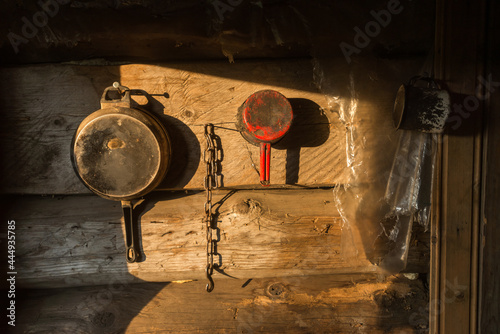 Dishes on wooden wall in touristic refuge in Maramures