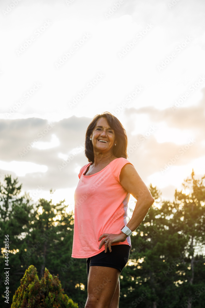 Portrait of hispanic woman with sportswear looking at camera and laughing Portrait of hispanic woman with sportswear looking at camera and laughing