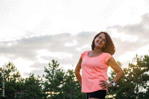 Portrait of mature latinx laughing before doing sport