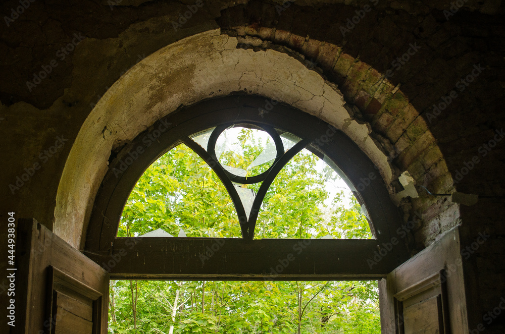 Window of abandoned Roze school, Latvia.